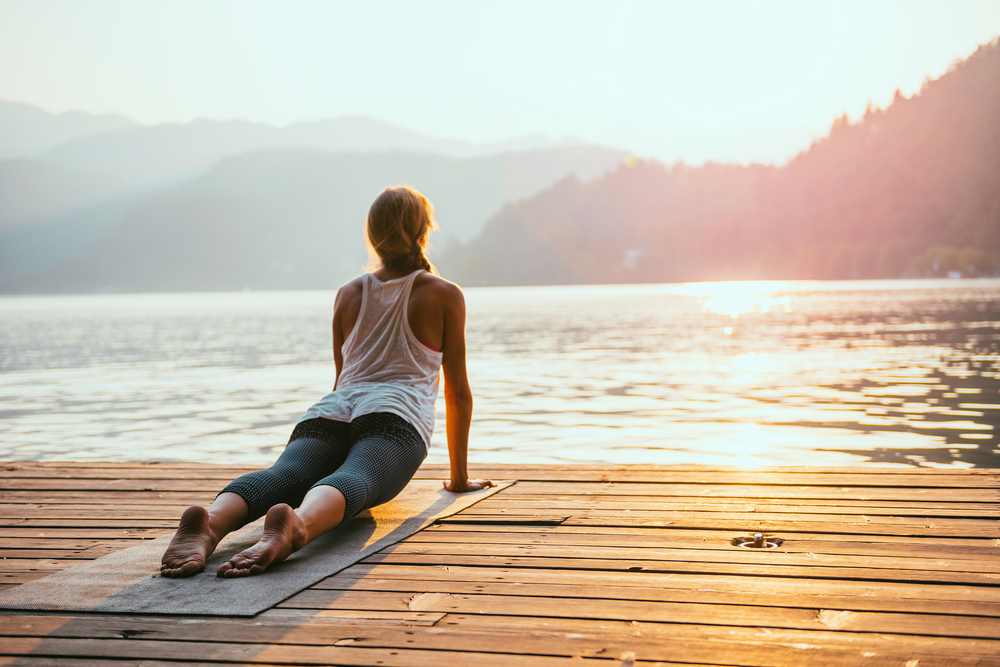 Woman performing upper body full body stretching routine with excellent posture and form